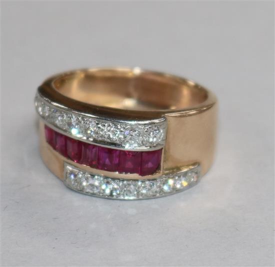 A 1950s yellow metal, ruby and diamond set cocktail ring, size Q.